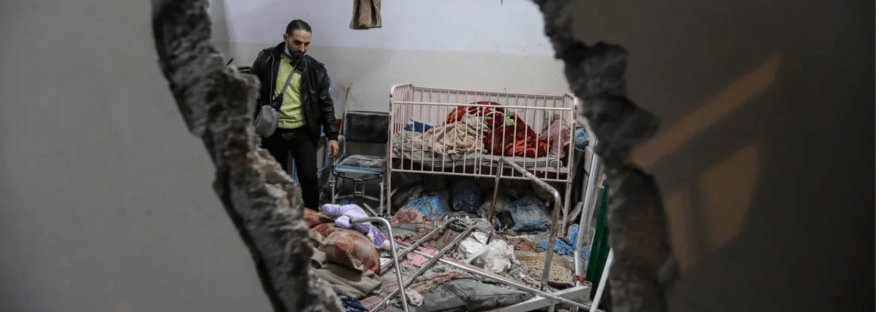 People inspect the damage caused by an artillery shell that hit the maternity hospital inside the Nasser Medical Complex, in Khan Younis, Gaza on December 17. Ahmad Hasaballah/Getty Images